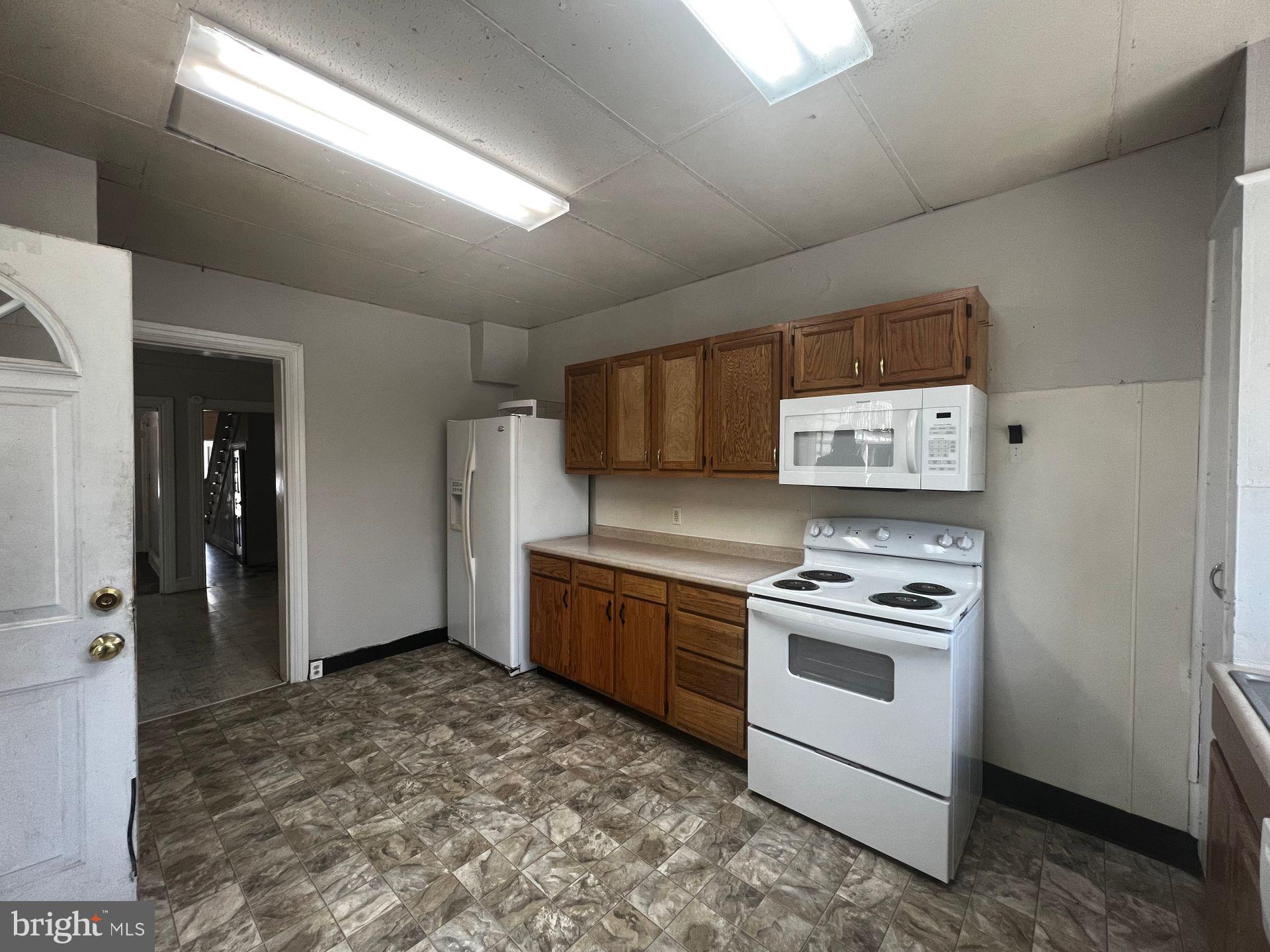 306 West Jackson Street York, PA 17401 - Photo 9 of 15 a kitchen with a stove and a refrigerator