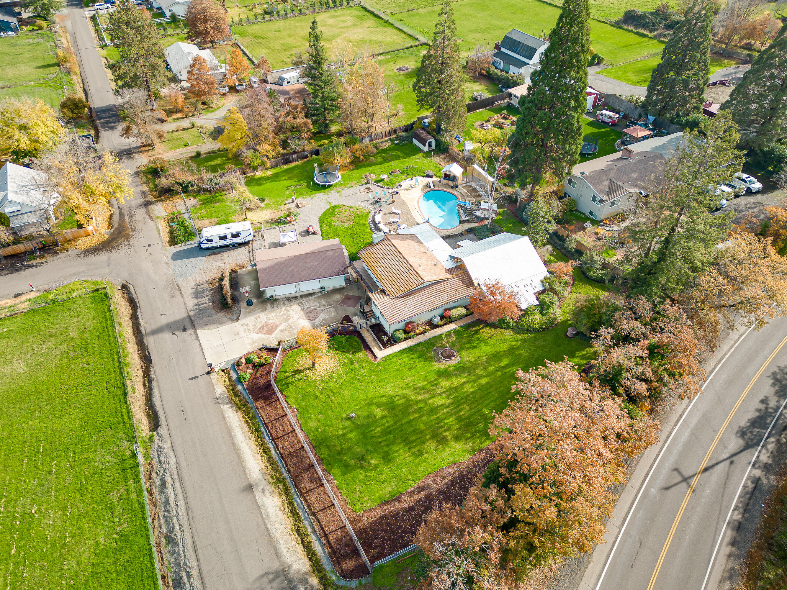 3010 Sylvia Road Central Point, OR 97502 - Photo 60 of 65 an aerial view of a house with a garden and swimming pool