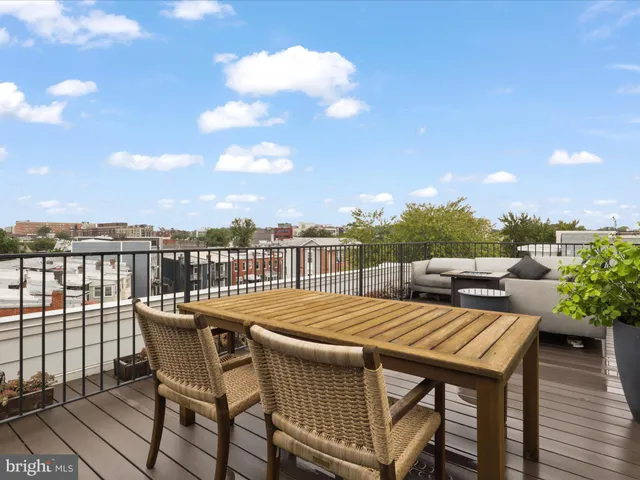 a view of roof deck with patio
