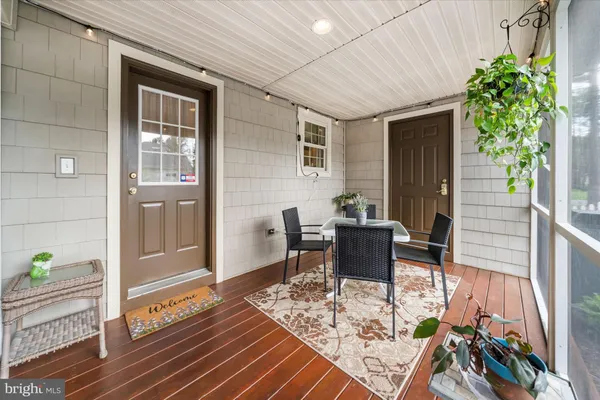 a house view with a sitting space and garden space