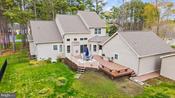 a view of a backyard with sitting area