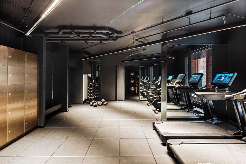55 Lagrange Street, Unit 409 Boston, MA 02111 - Photo 26 of 29 a view of a room with gym equipment