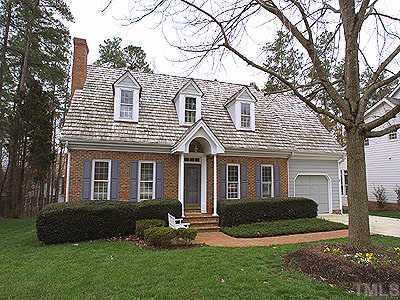 2001 Carrbridge Way Raleigh, NC 27615 - Photo 1 of 1 a front view of a house with a yard and large tree