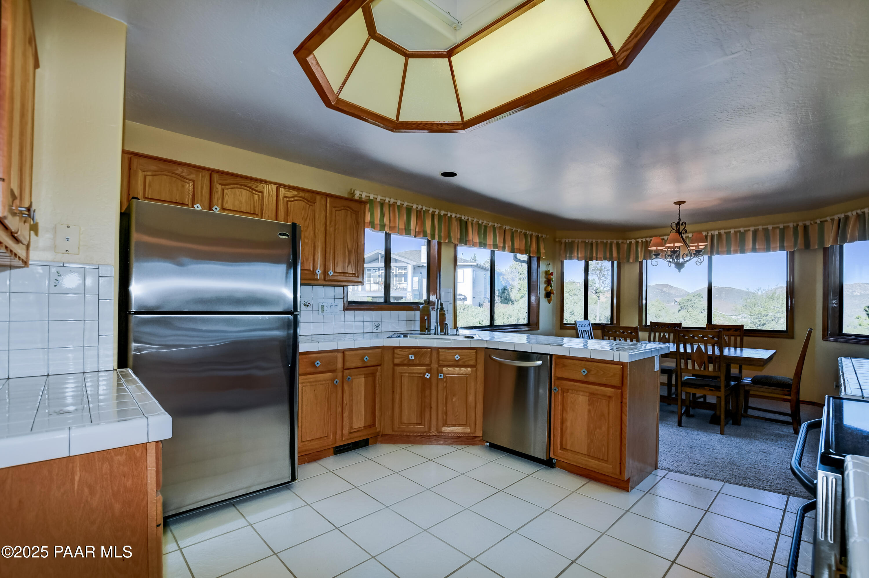 1881 Forest View Prescott, AZ 86305 - Photo 11 of 46 a kitchen with stainless steel appliances granite countertop a sink and a refrigerator