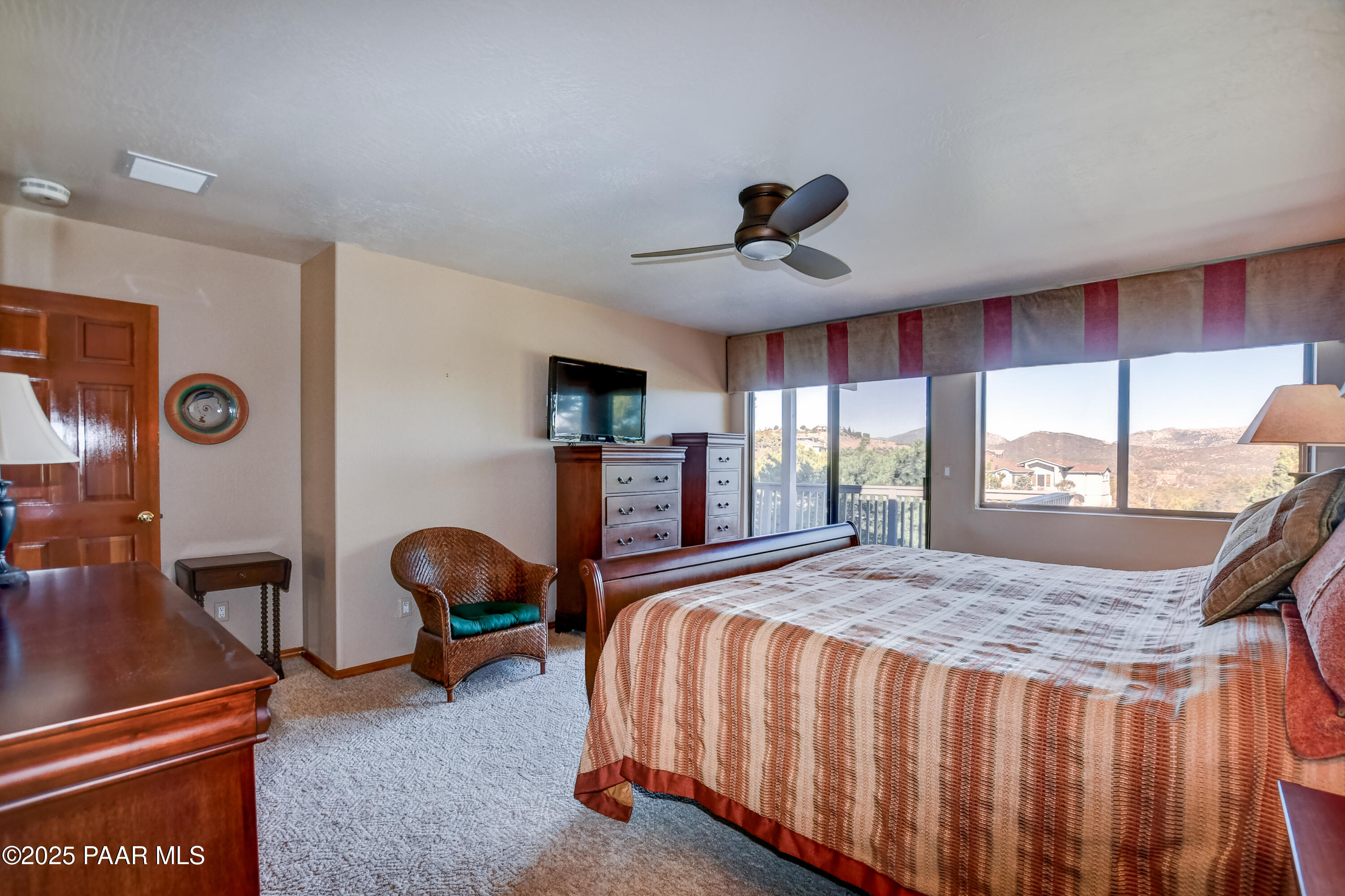 1881 Forest View Prescott, AZ 86305 - Photo 18 of 46 a bed sitting in a spacious bedroom next to a window