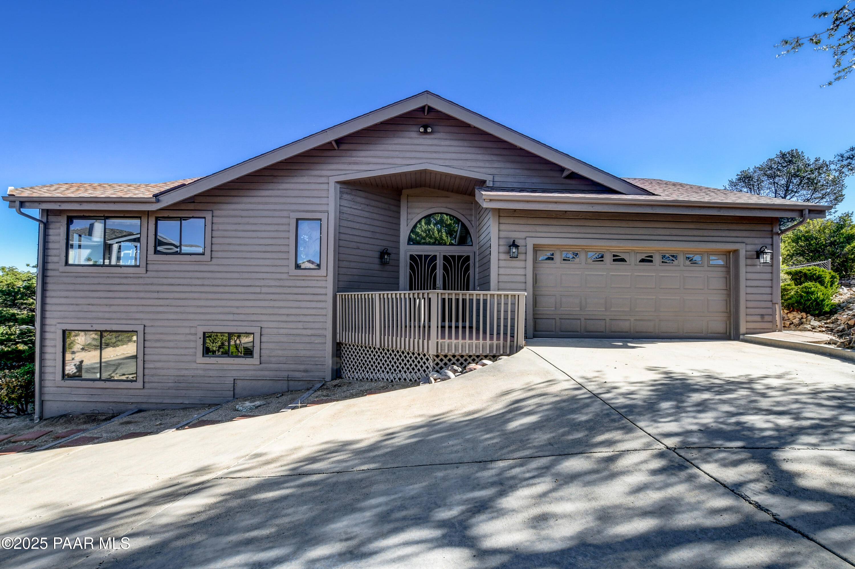 1881 Forest View Prescott, AZ 86305 - Photo 2 of 46 a front view of a house with a garage