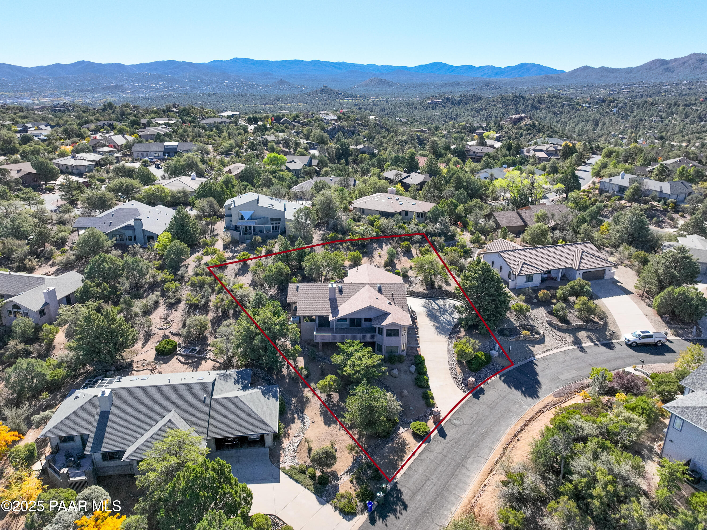 1881 Forest View Prescott, AZ 86305 - Photo 41 of 46 an aerial view of a city with lots of residential buildings and mountain view in back