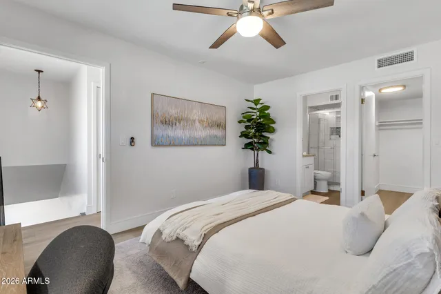 an aerial view of a house with a garden and lake view