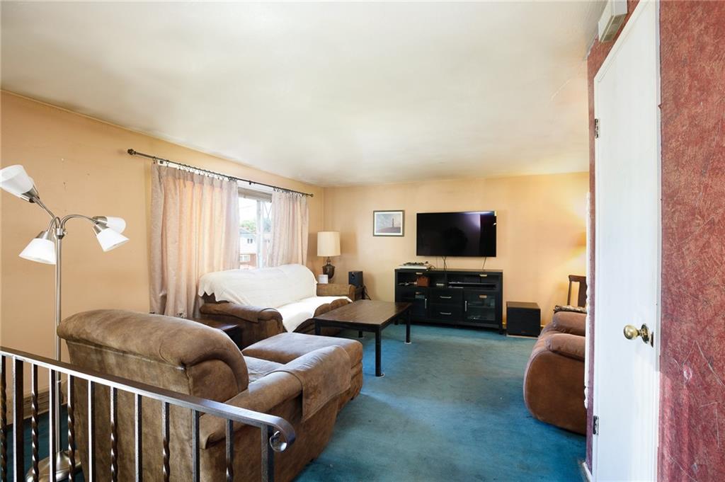528 MacBeth Drive Pittsburgh, PA 15235 - Photo 2 of 20 a living room with furniture and a flat screen tv