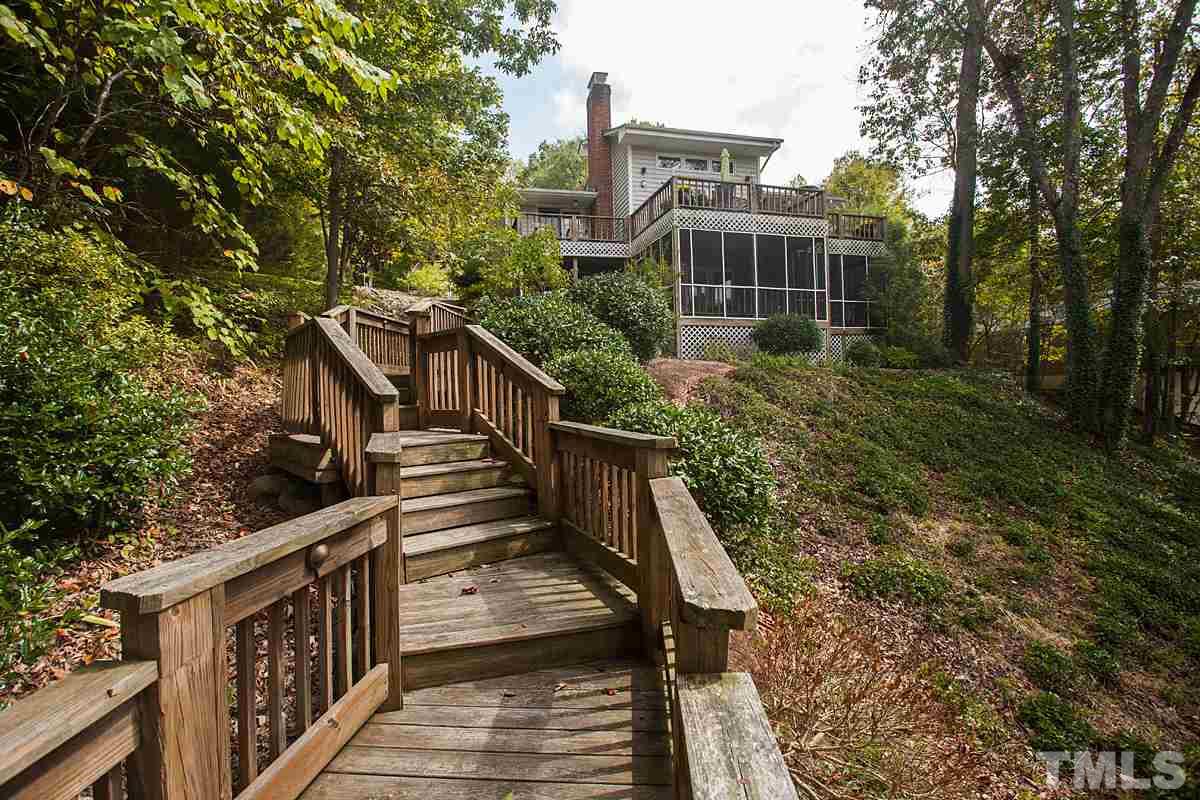 11 Hidden Hills Road Roxboro, NC 27574 - Photo 3 of 25 a view of a house with backyard and trees