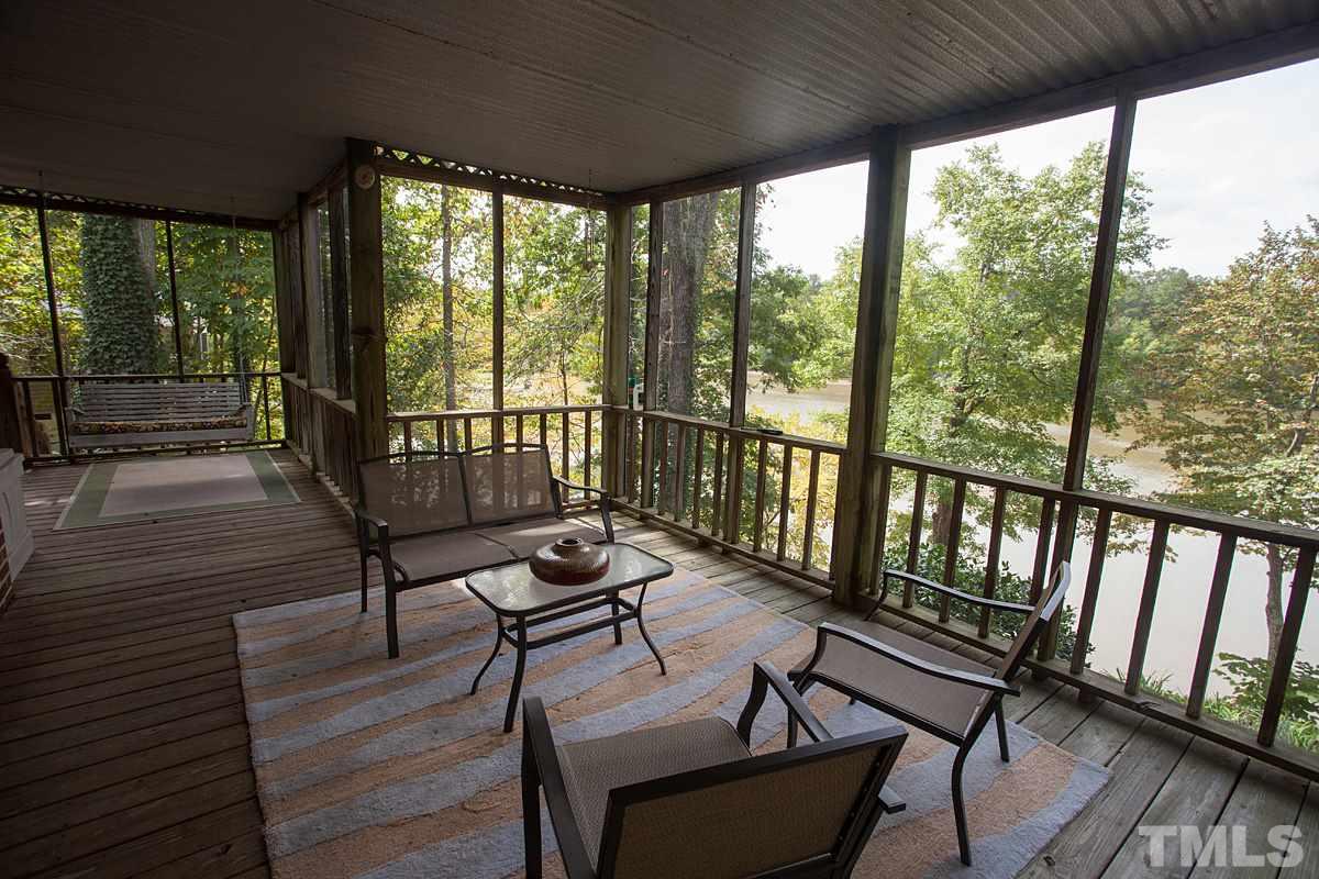 11 Hidden Hills Road Roxboro, NC 27574 - Photo 22 of 25 a view of a two chairs in the balcony