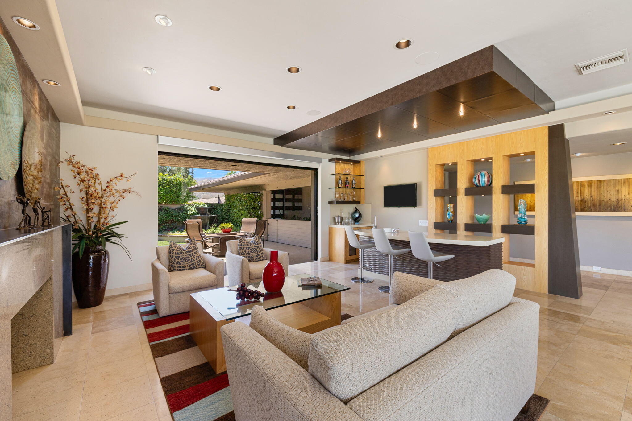 4 Barnard Court Rancho Mirage, CA 92270 - Photo 12 of 62 a living room with furniture and a flat screen tv