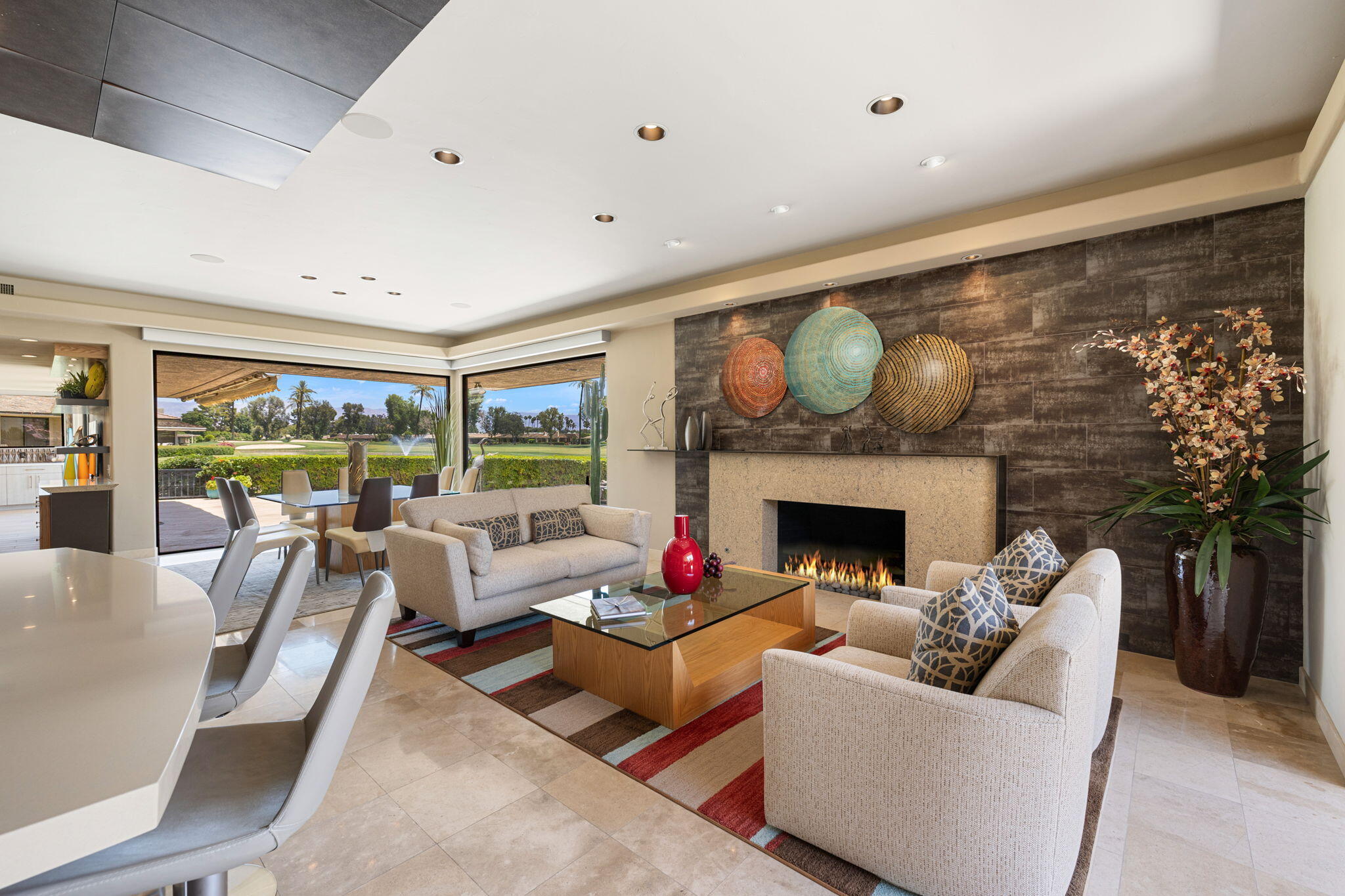 4 Barnard Court Rancho Mirage, CA 92270 - Photo 14 of 62 a living room with furniture fireplace and a large window