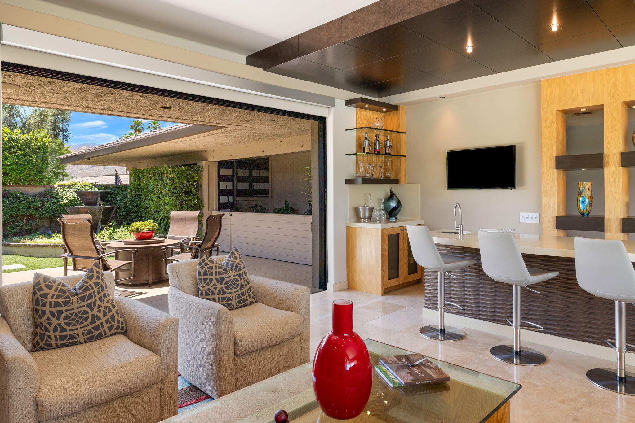 4 Barnard Court Rancho Mirage, CA 92270 - Photo 15 of 62 a living room with furniture and a flat screen tv