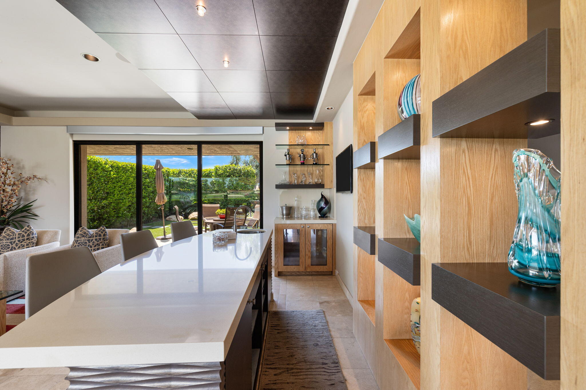 4 Barnard Court Rancho Mirage, CA 92270 - Photo 18 of 62 a dining room with furniture water view and large windows
