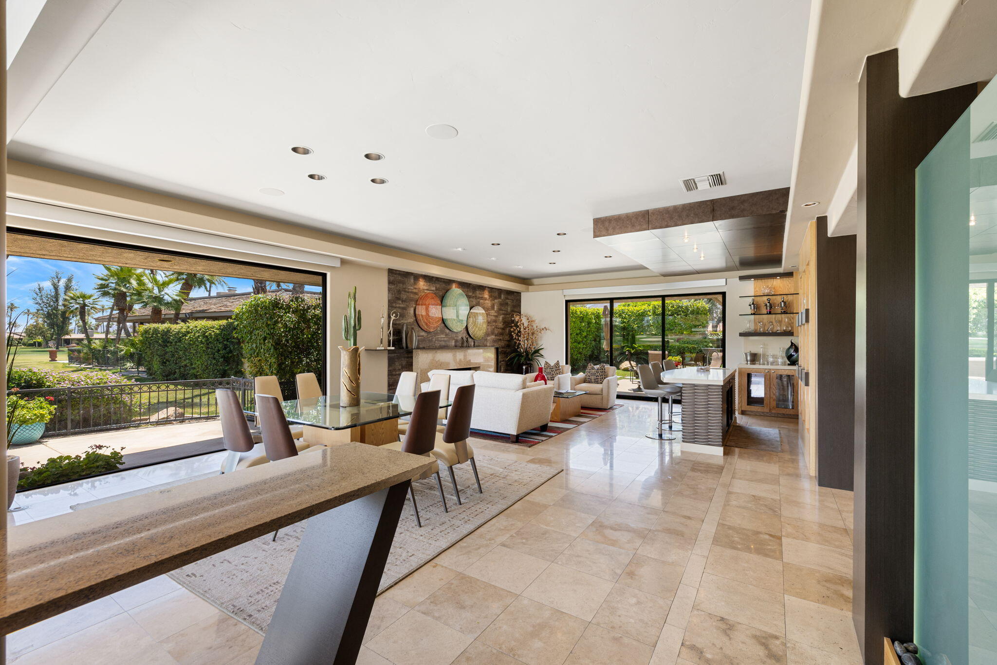 4 Barnard Court Rancho Mirage, CA 92270 - Photo 20 of 62 a living room with furniture floor to ceiling window and garden