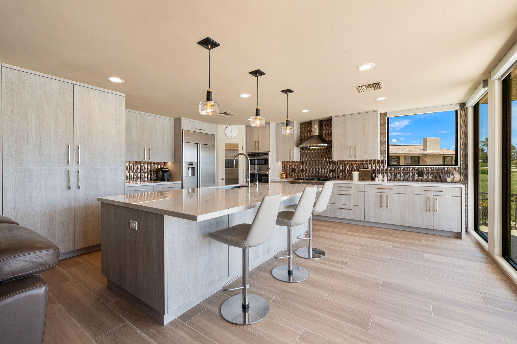 4 Barnard Court Rancho Mirage, CA 92270 - Photo 23 of 62 a kitchen with stainless steel appliances kitchen island granite countertop a sink and cabinets