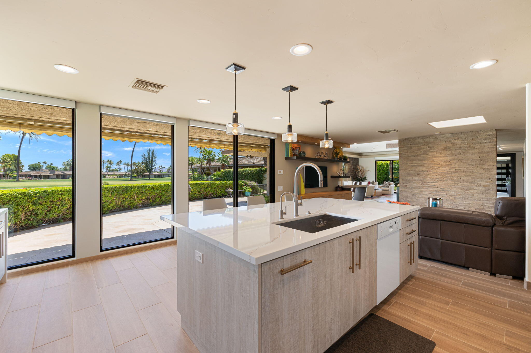 4 Barnard Court Rancho Mirage, CA 92270 - Photo 28 of 62 a kitchen with stainless steel appliances granite countertop a sink and a wooden floor