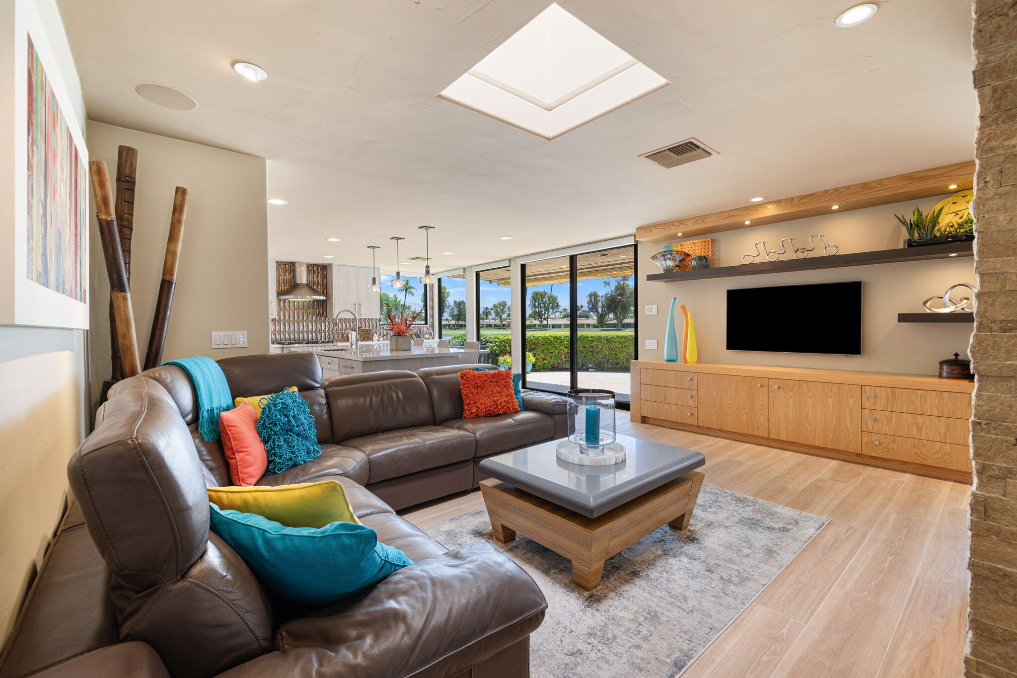 4 Barnard Court Rancho Mirage, CA 92270 - Photo 30 of 62 a living room with furniture and a flat screen tv