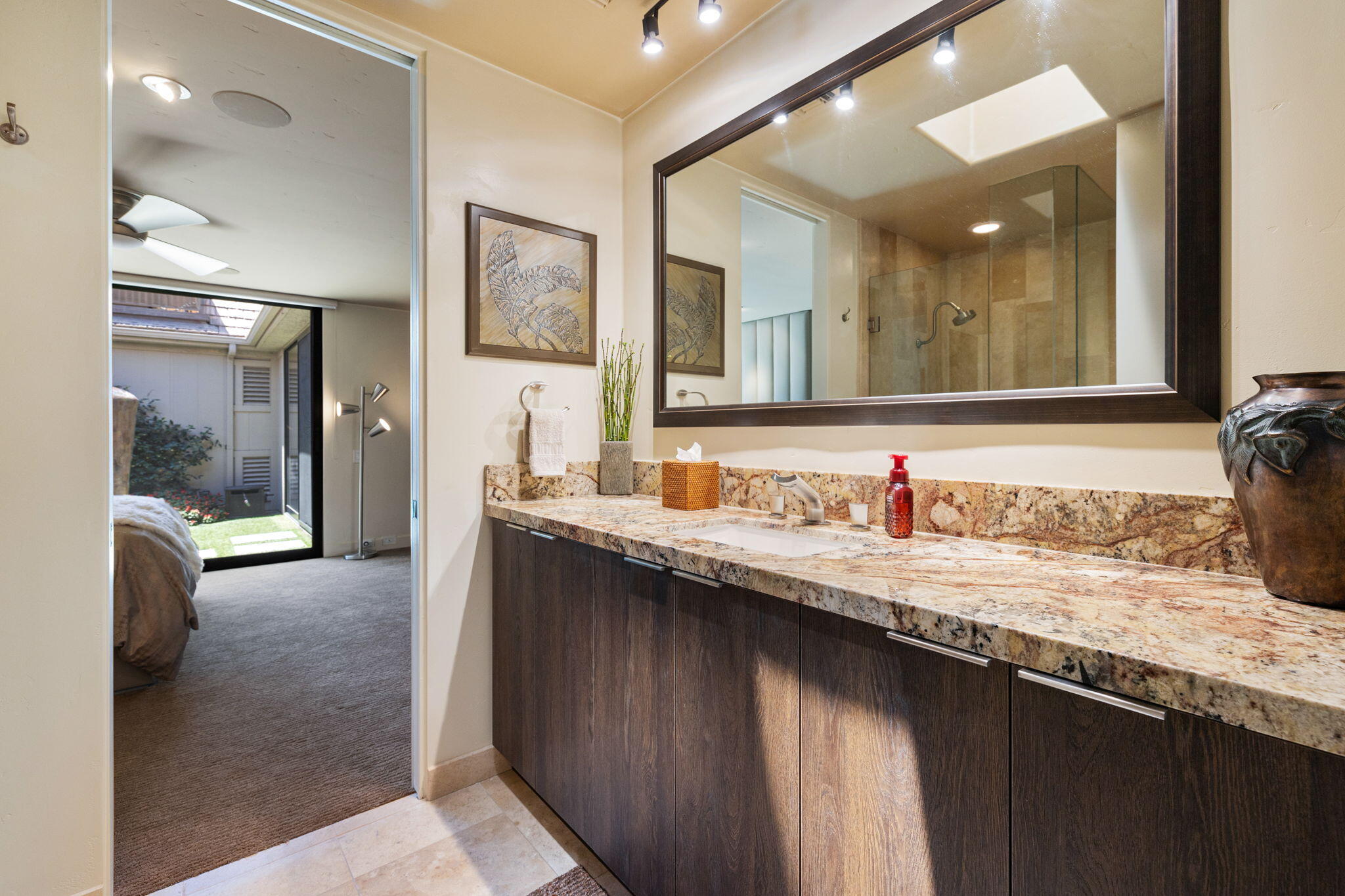 4 Barnard Court Rancho Mirage, CA 92270 - Photo 49 of 62 a bathroom with a granite countertop double vanity sink and a mirror