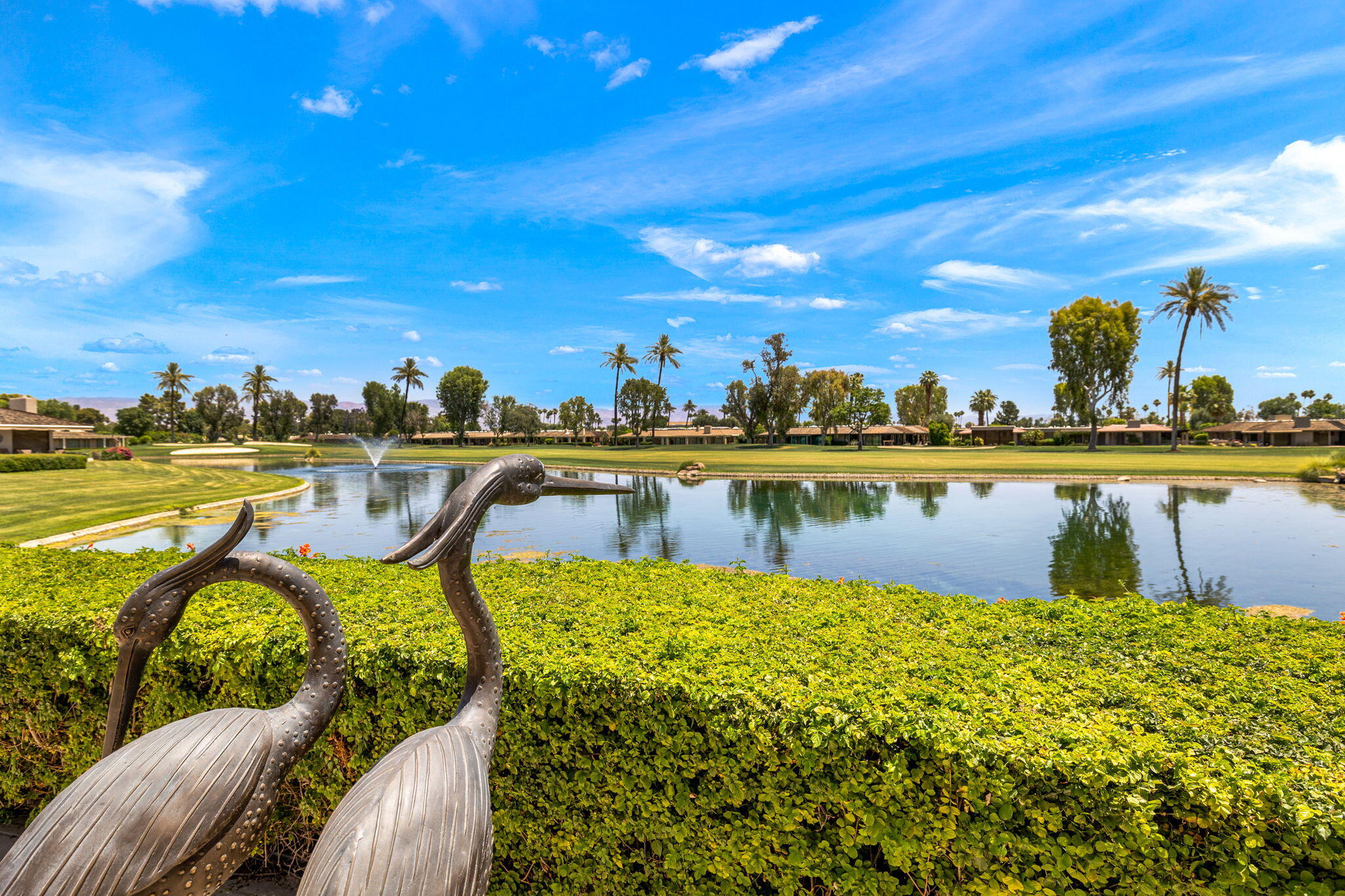 4 Barnard Court Rancho Mirage, CA 92270 - Photo 54 of 62 a view of a swimming pool with outdoor seating and city view