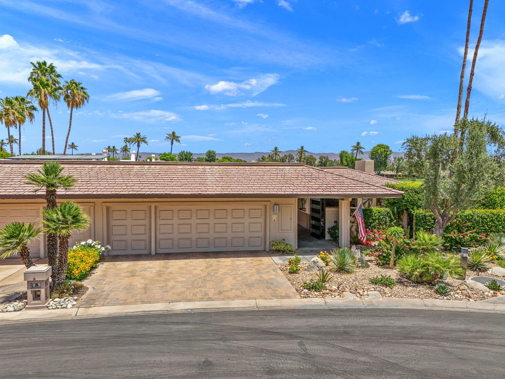 4 Barnard Court Rancho Mirage, CA 92270 - Photo 56 of 62 a front view of a house with a yard