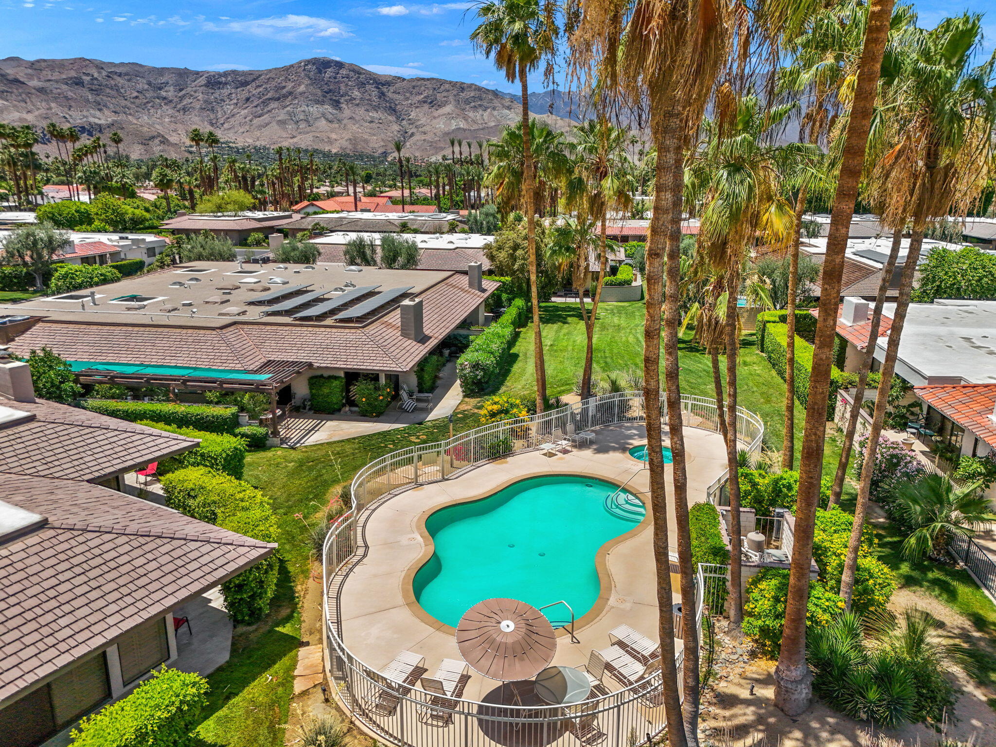 4 Barnard Court Rancho Mirage, CA 92270 - Photo 61 of 62 a view of a swimming pool with a patio