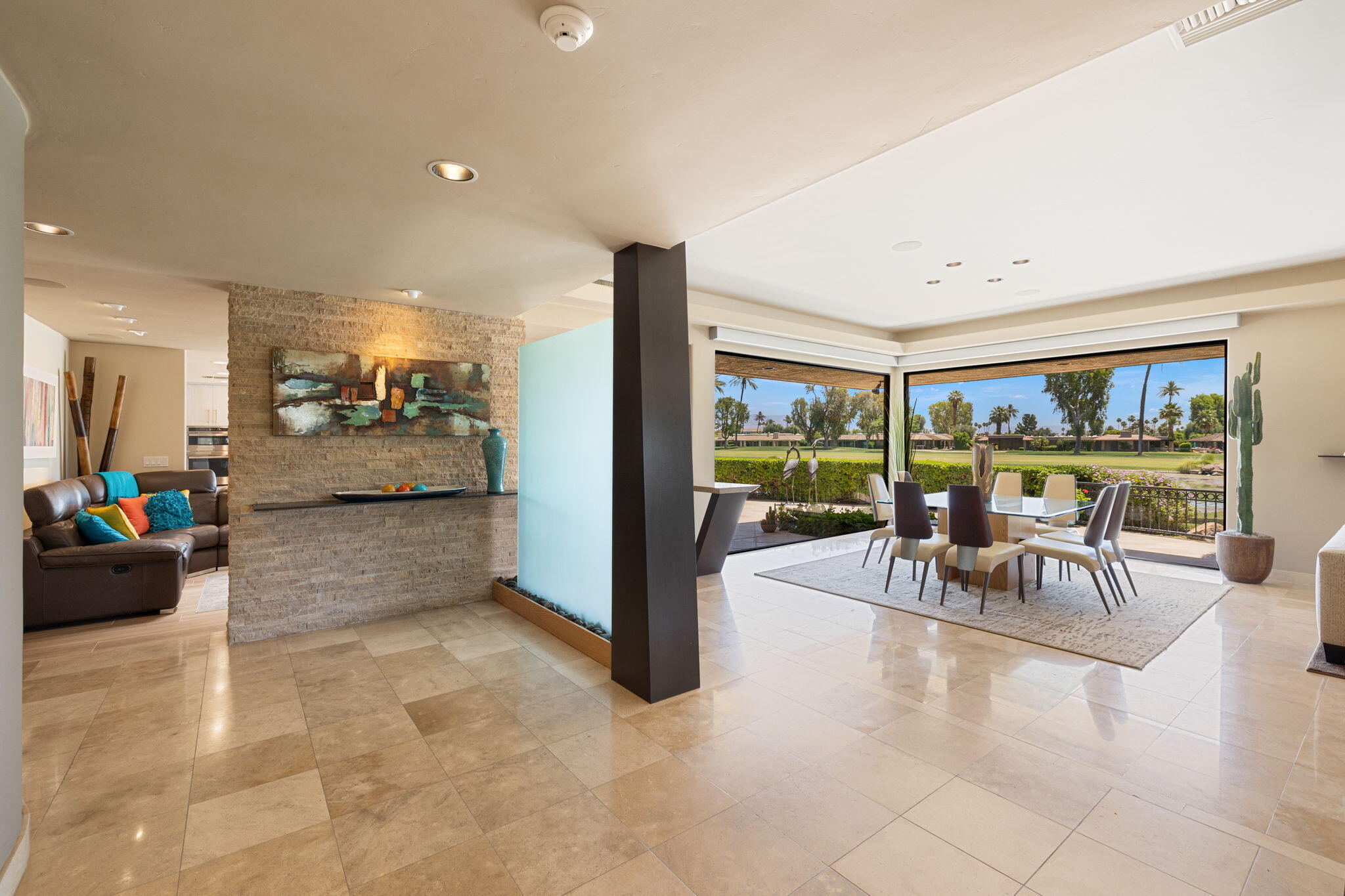 4 Barnard Court Rancho Mirage, CA 92270 - Photo 8 of 62 a view of a livingroom with furniture and a large window