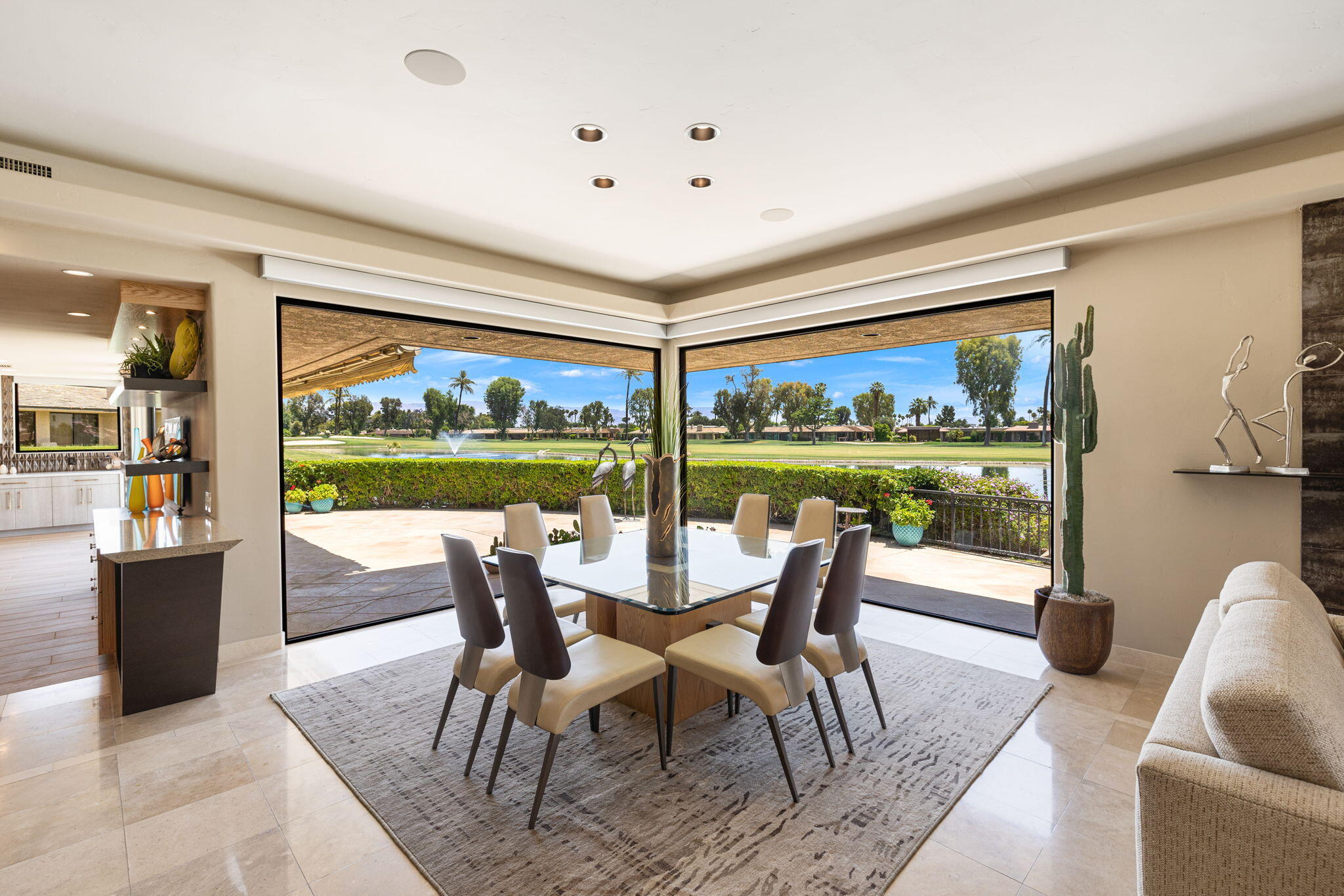 4 Barnard Court Rancho Mirage, CA 92270 - Photo 9 of 62 a dining room with furniture and a floor to ceiling window