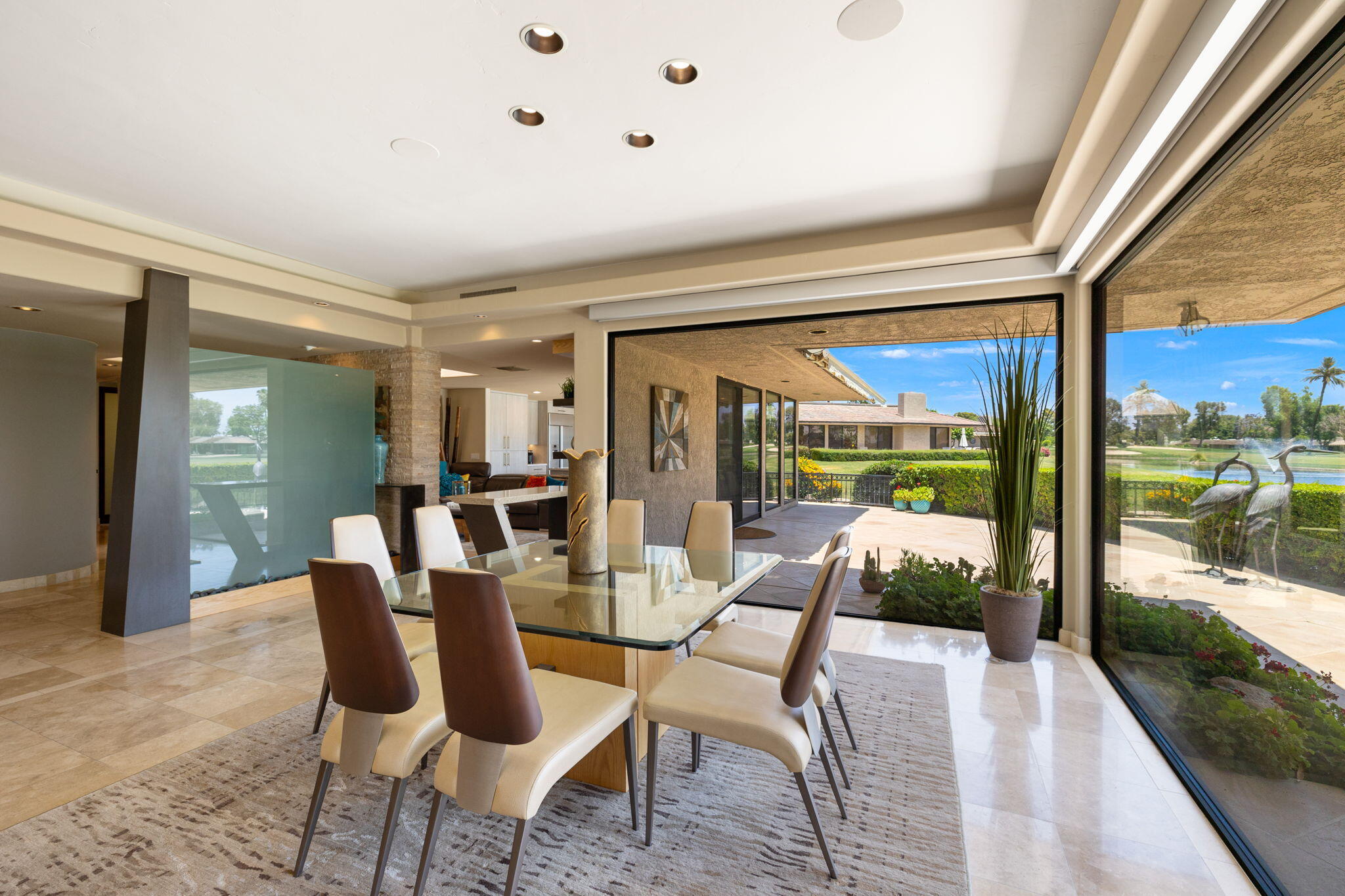 4 Barnard Court Rancho Mirage, CA 92270 - Photo 10 of 62 a dining room with furniture and a floor to ceiling window