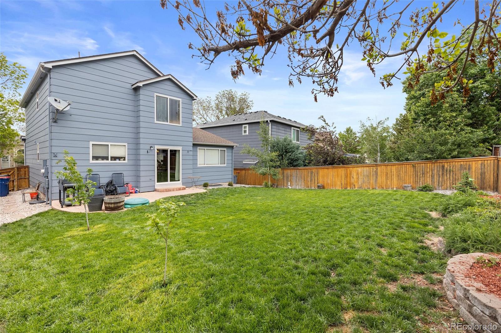 10565 Hyacinth Place Highlands Ranch, CO 80129 - Photo 30 of 33 a view of a house with backyard and sitting area