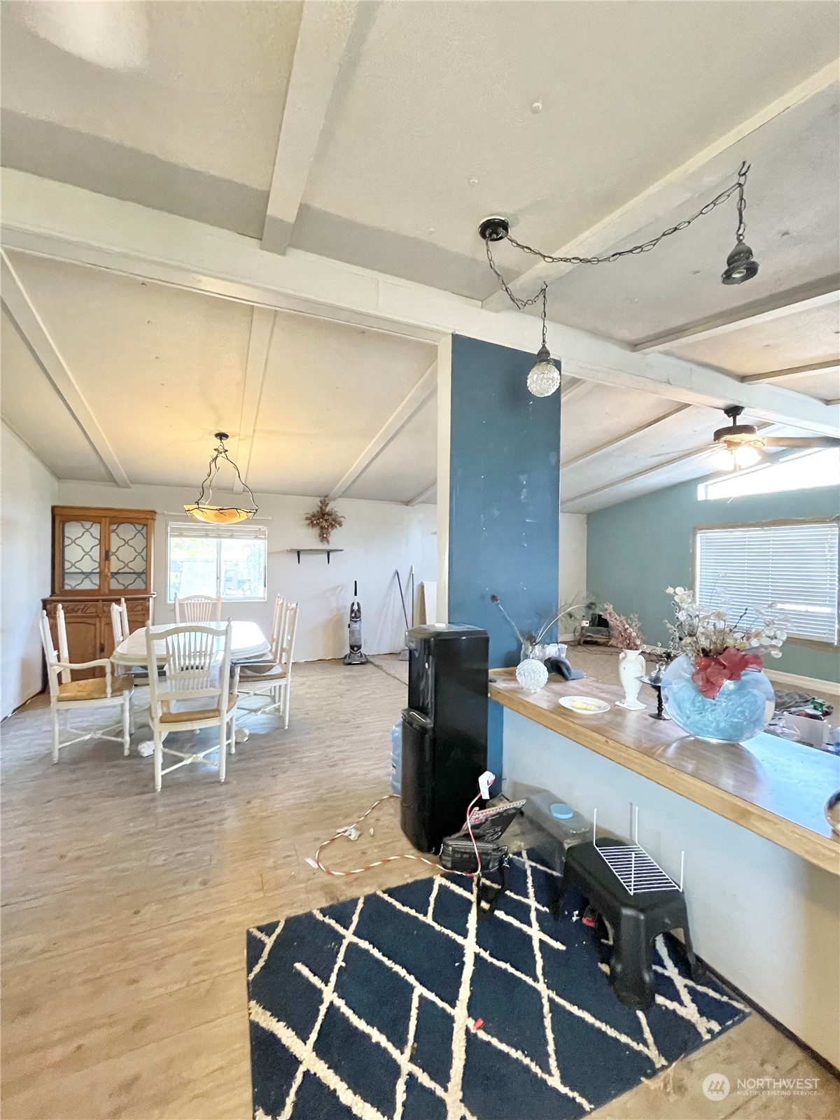 52 Engh Road, Unit 26 Omak, WA 98841 - Photo 14 of 29 a room with lots of wooden furniture and a chandelier