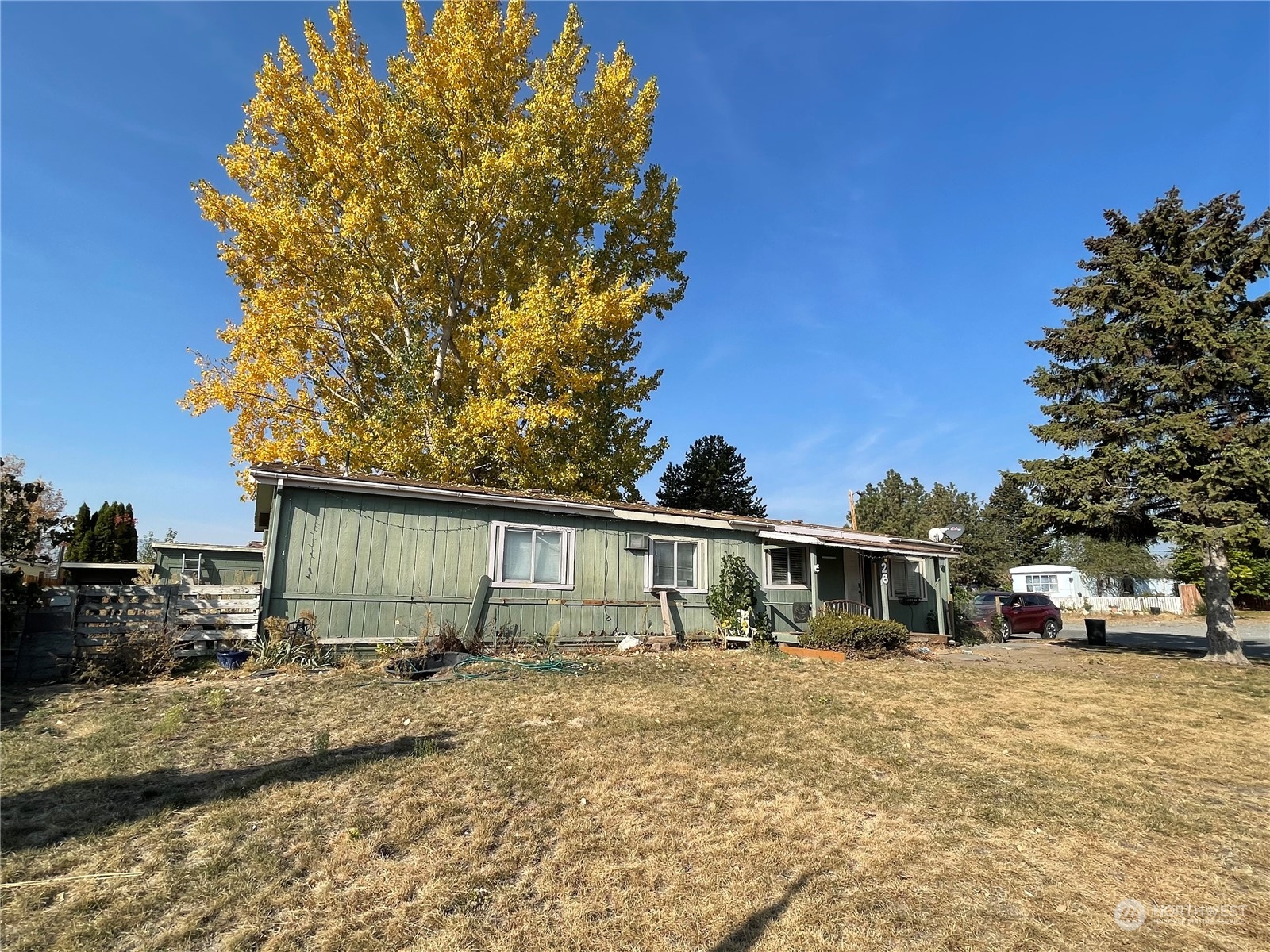 52 Engh Road, Unit 26 Omak, WA 98841 - Photo 2 of 29 a front view of a house with garden