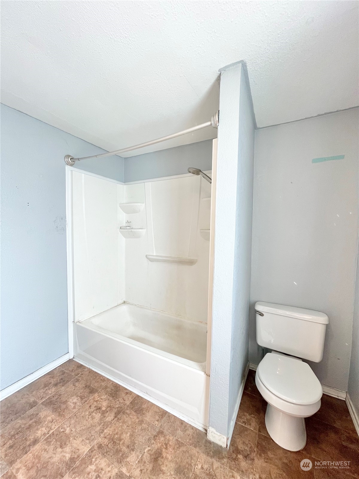 52 Engh Road, Unit 26 Omak, WA 98841 - Photo 25 of 29 a bathroom with a toilet and a shower