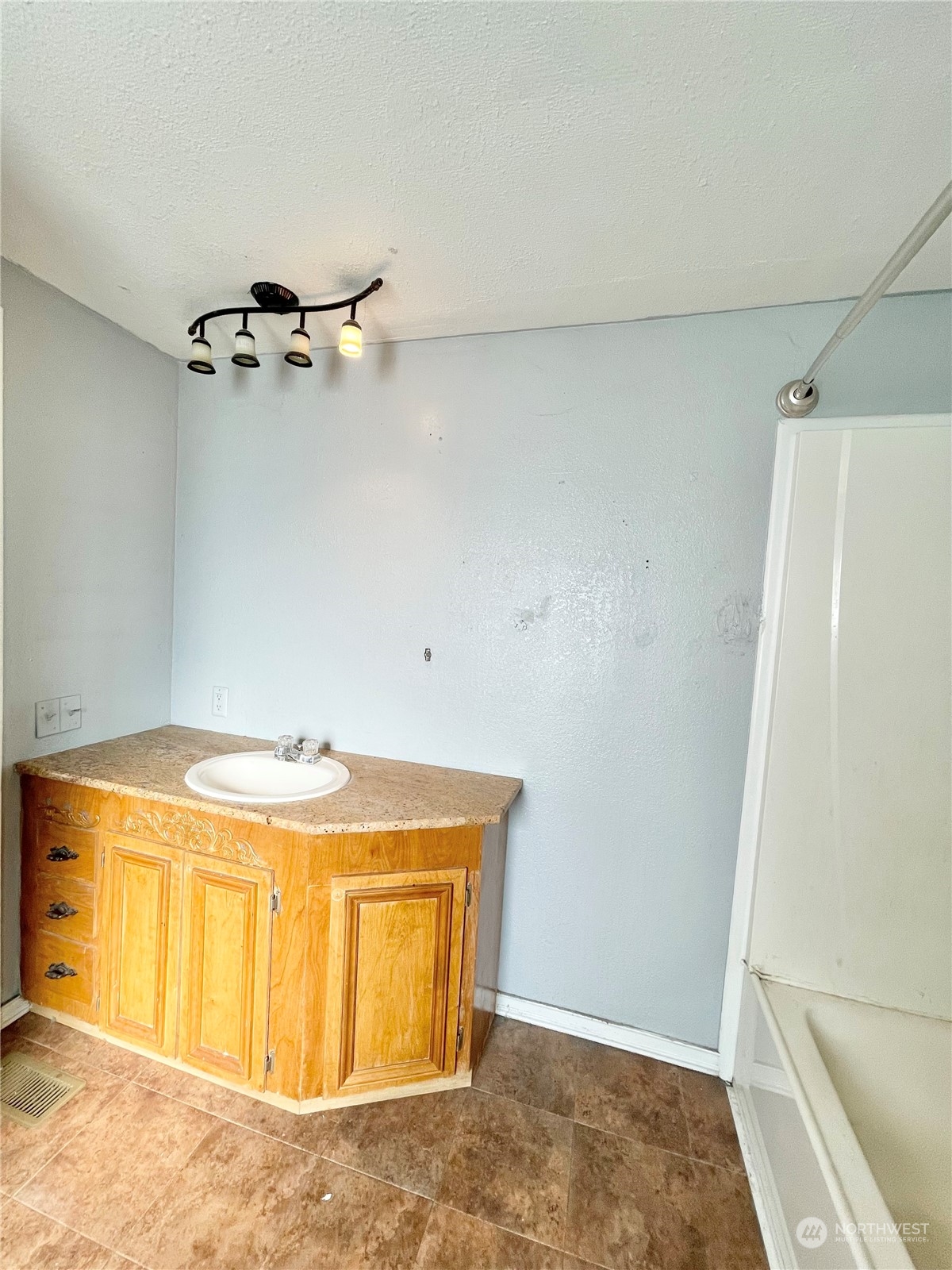 52 Engh Road, Unit 26 Omak, WA 98841 - Photo 26 of 29 a view of a storage & utility room with a window