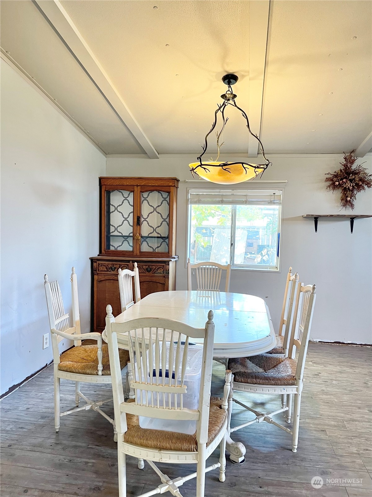 52 Engh Road, Unit 26 Omak, WA 98841 - Photo 8 of 29 a view of a dining room with furniture window and wooden floor