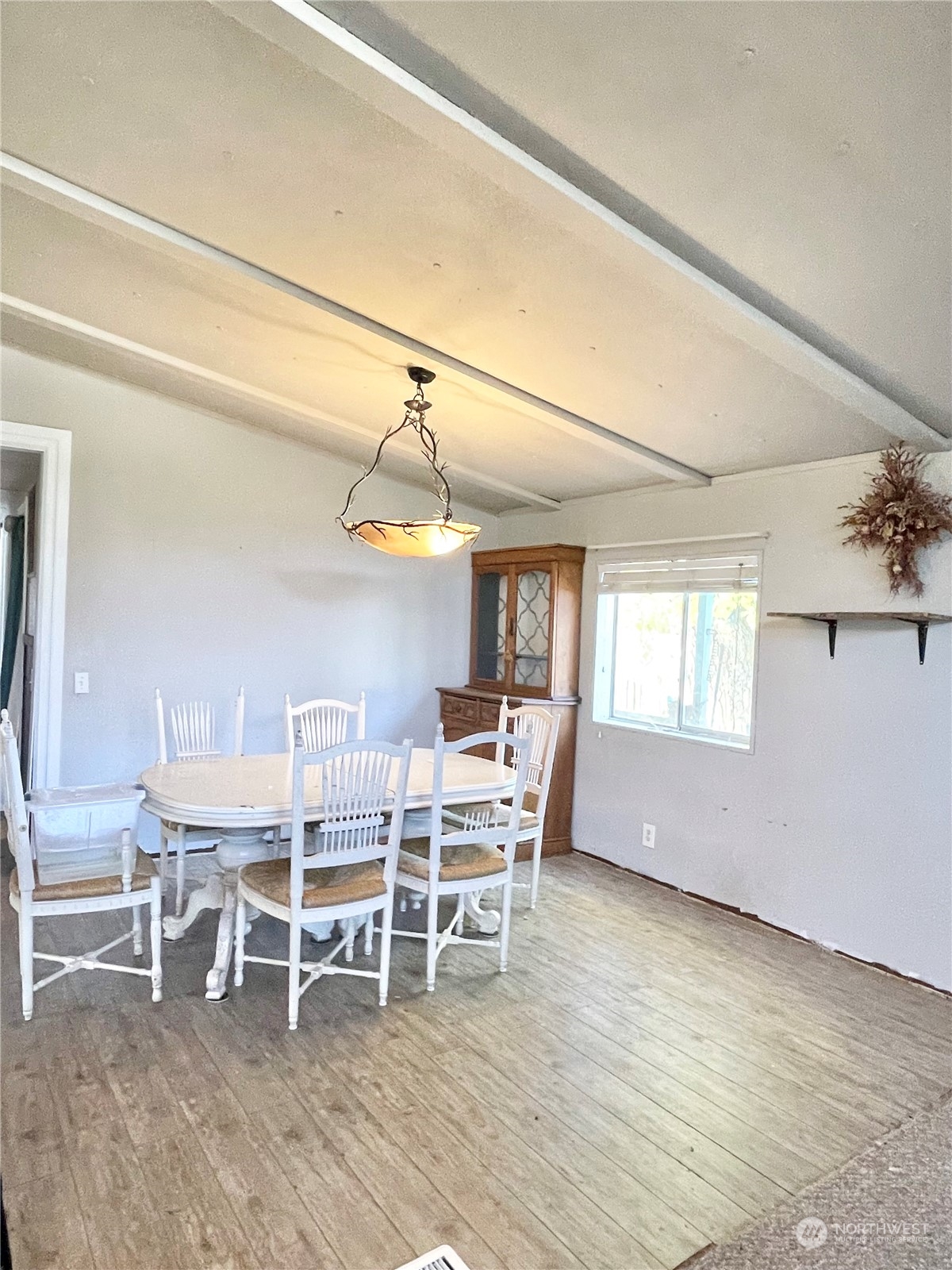 52 Engh Road, Unit 26 Omak, WA 98841 - Photo 9 of 29 a dining room with a wooden table and chairs