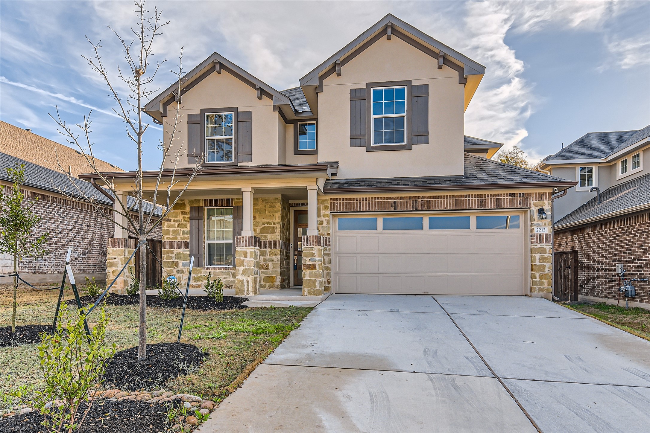 2212 Alamar Walk Leander, TX 78641 - Photo 1 of 29 a front view of a house with a garden and plants