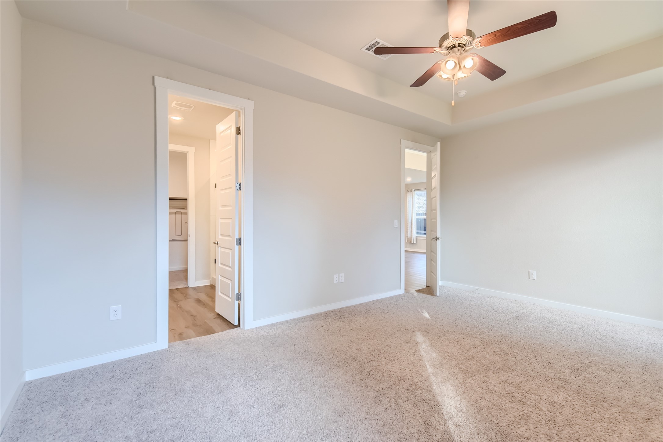 2212 Alamar Walk Leander, TX 78641 - Photo 12 of 29 an empty room with closet and a ceiling fan