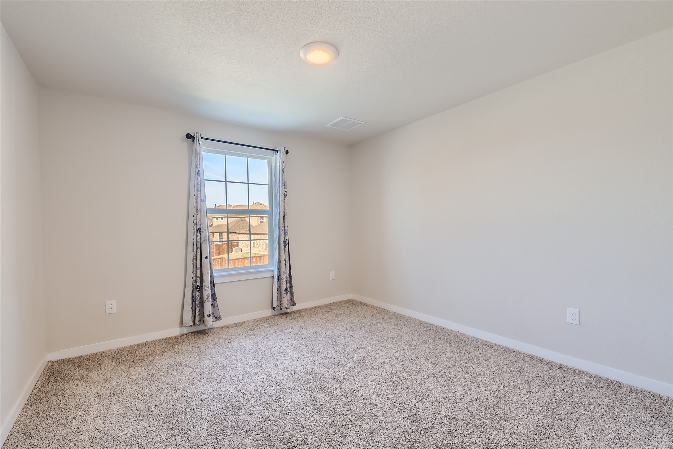 2212 Alamar Walk Leander, TX 78641 - Photo 19 of 29 an empty room with windows