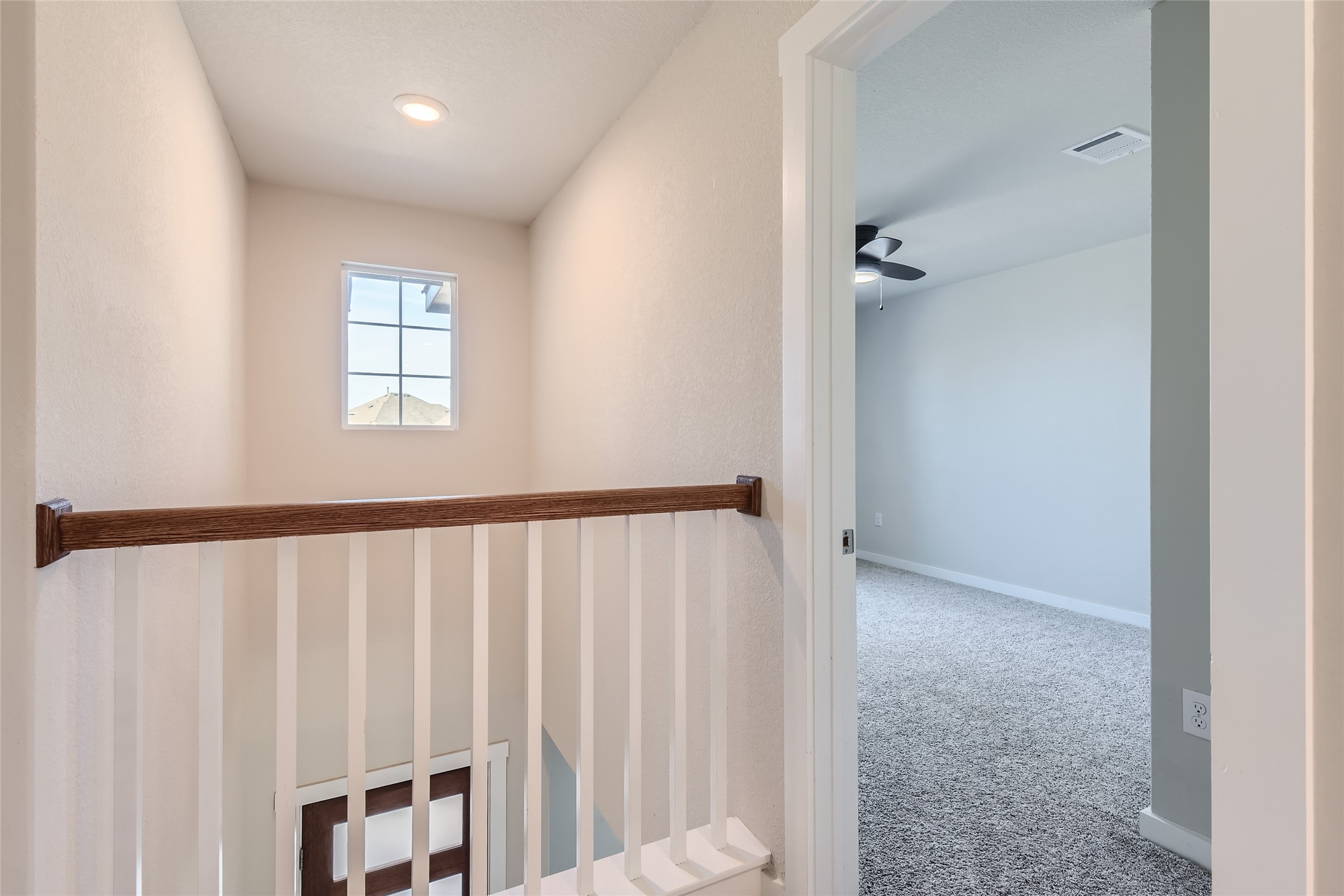 2212 Alamar Walk Leander, TX 78641 - Photo 24 of 29 a view of a hallway with windows