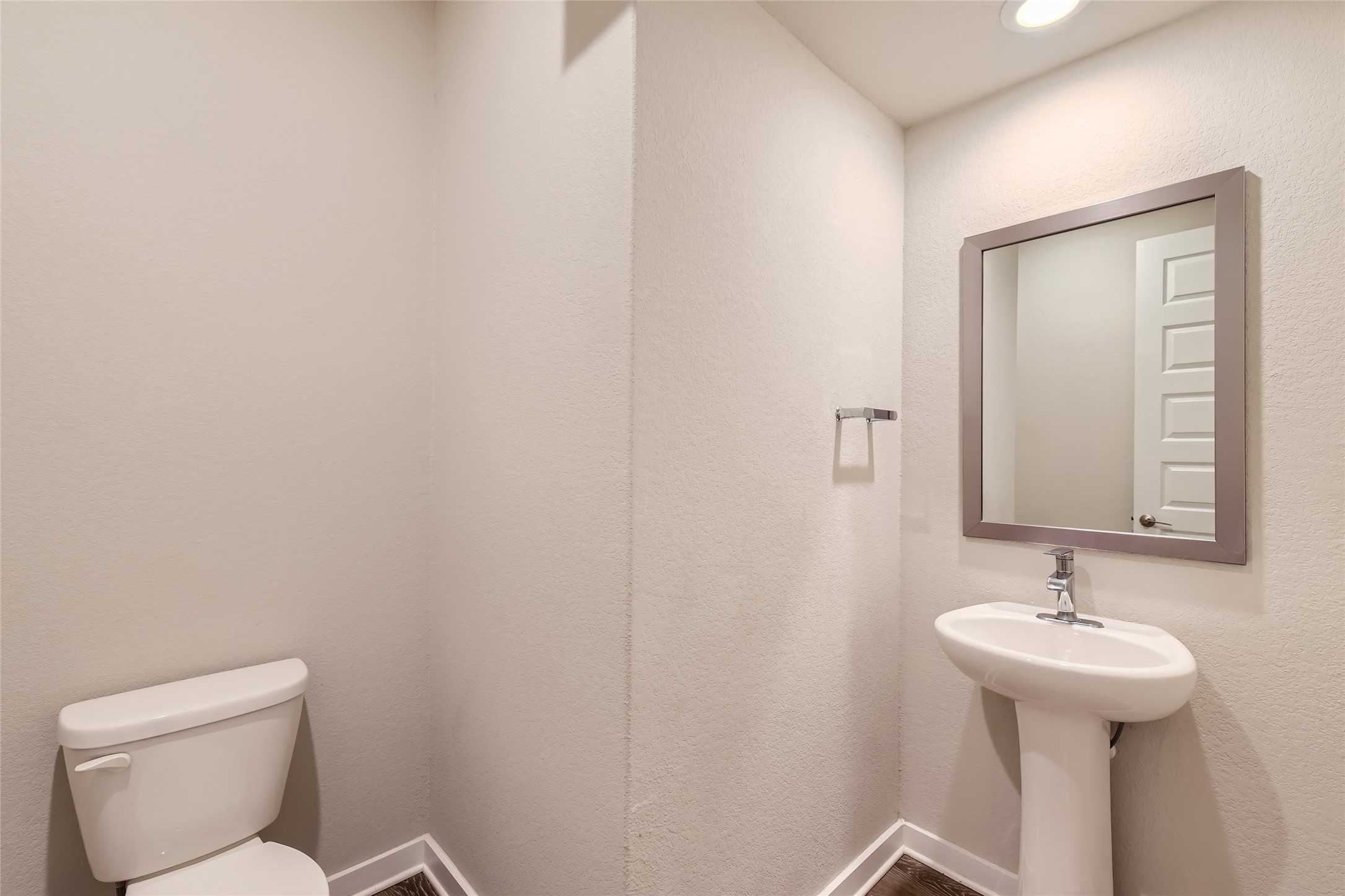 2212 Alamar Walk Leander, TX 78641 - Photo 10 of 29 a bathroom with a toilet sink and mirror