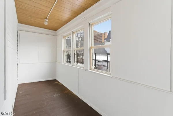 a view of empty room with windows