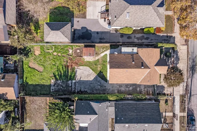 an aerial view of houses with outdoor space