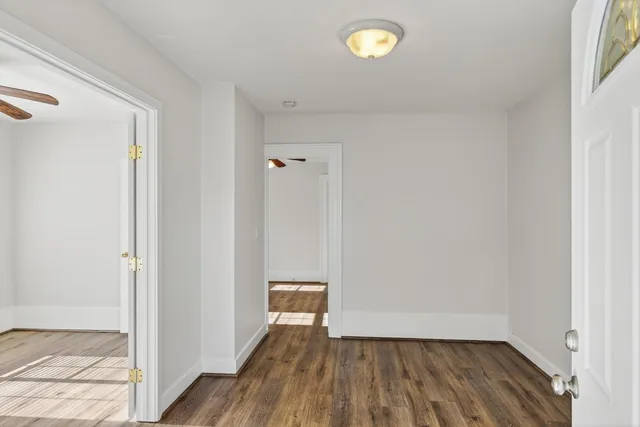 a view of room with wooden floor