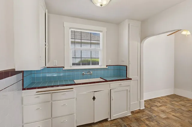 a kitchen with a sink and cabinets