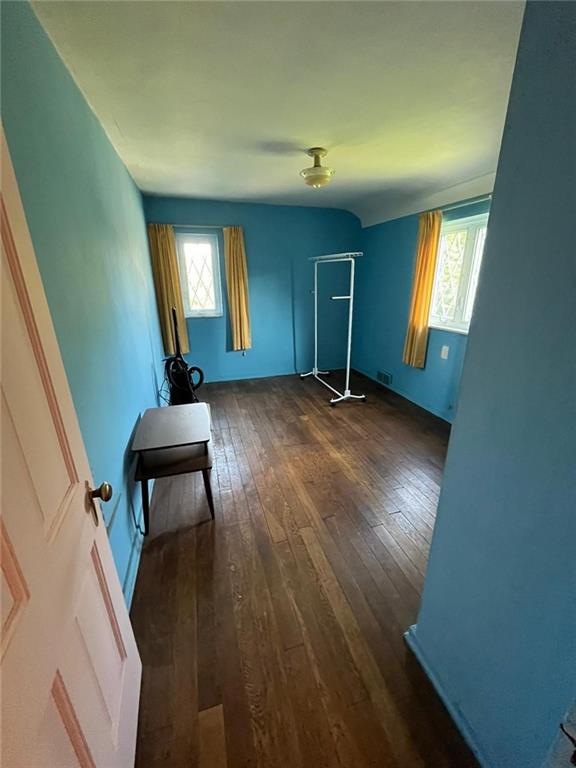 498 Highview Road Pittsburgh, PA 15228 - Photo 13 of 23 a view of a livingroom with wooden floor and windows