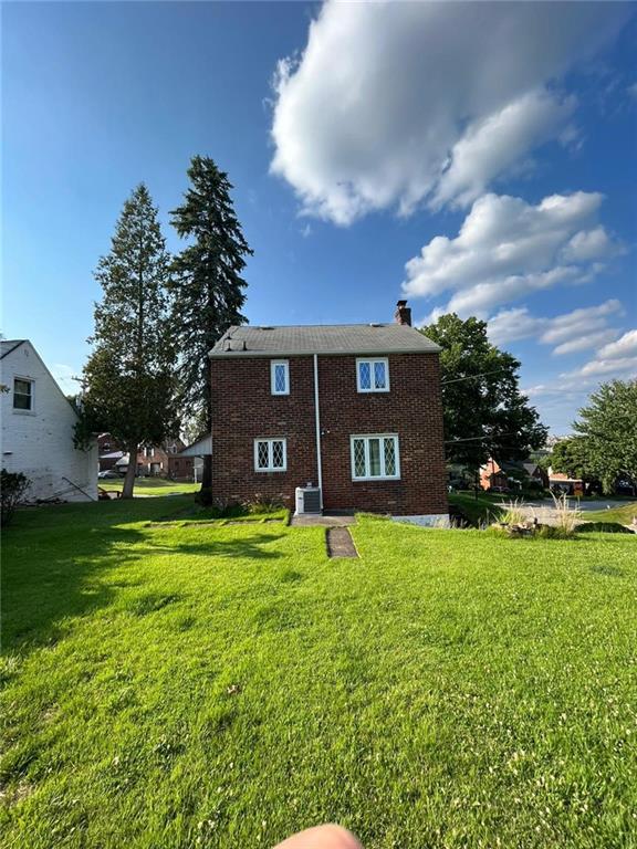 498 Highview Road Pittsburgh, PA 15228 - Photo 2 of 23 a large house with a big yard and large trees