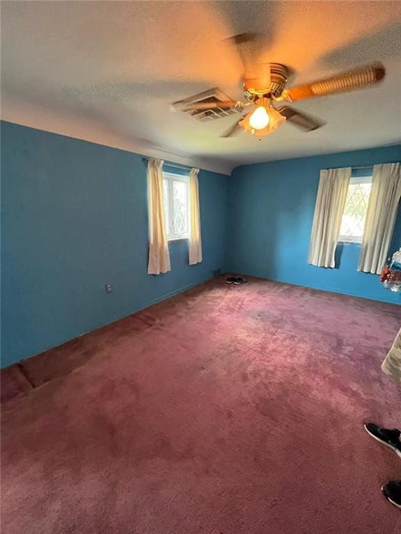 498 Highview Road Pittsburgh, PA 15228 - Photo 10 of 23 an empty room with windows and fan