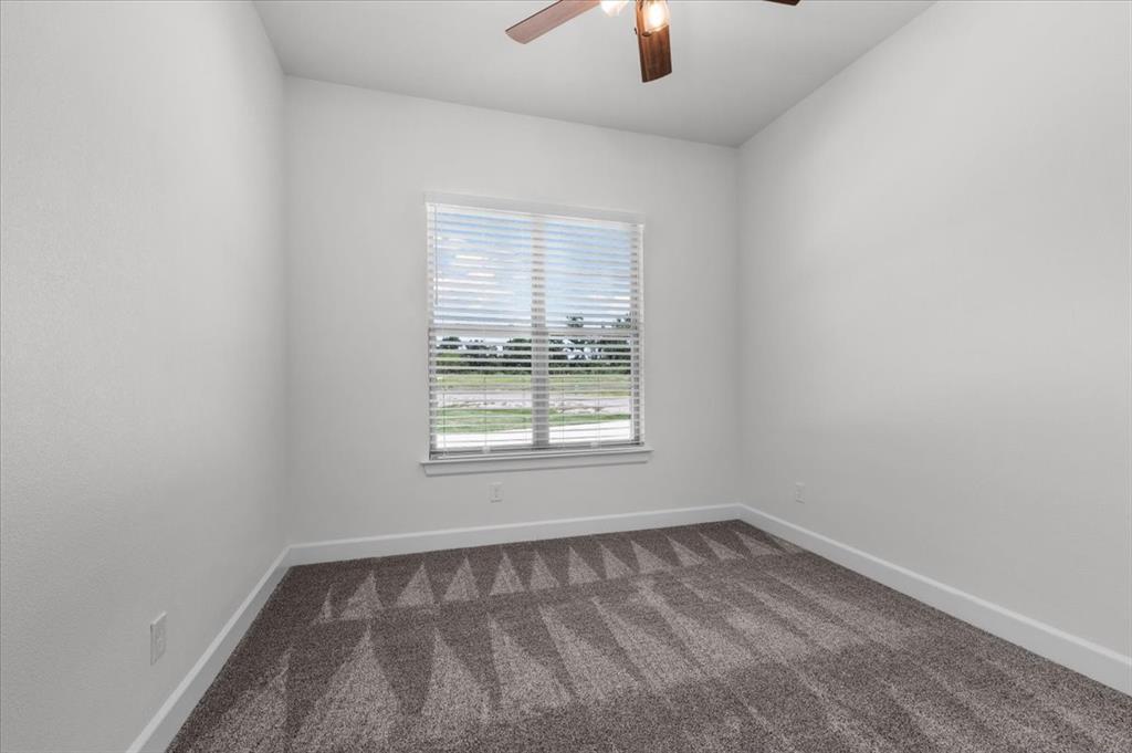 1039 Monaco Court Springtown, TX 76082 - Photo 24 of 33 Bedroom featuring like new carpet and fan
